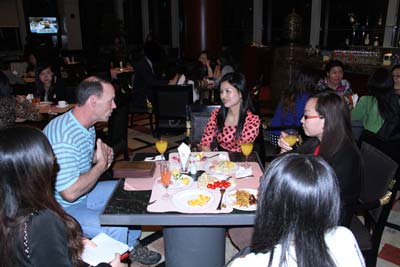 Asian women and a western man during socials.