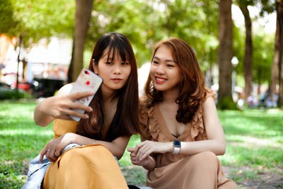  A photo of two beautiful Asian women taking a picture of themselves