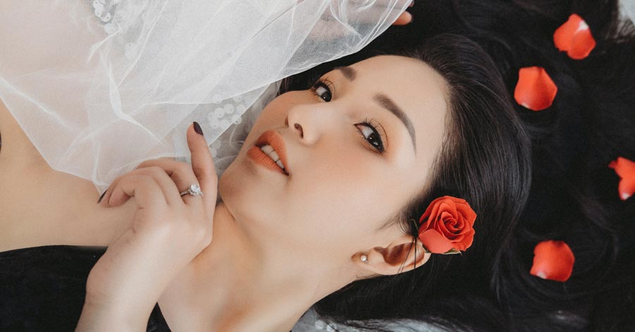 asian girl lying with roses